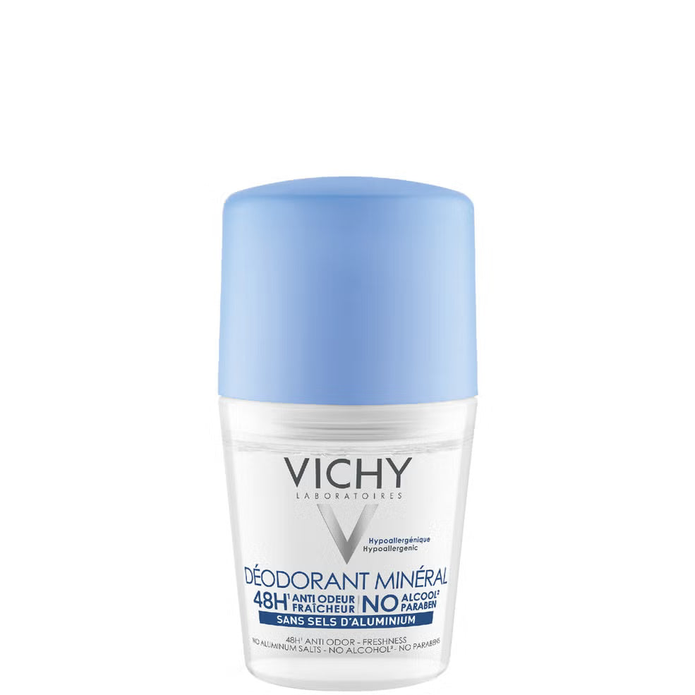 Vichy deodorant bottle with blue cap on a white background